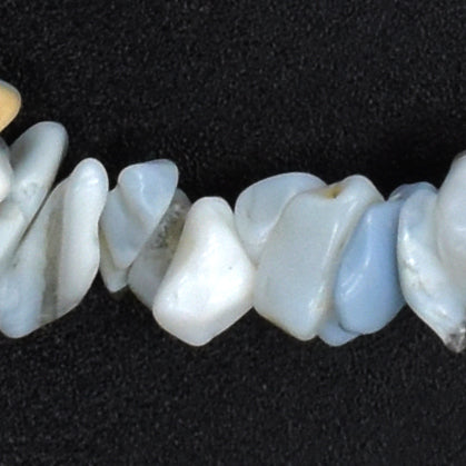high quality bracelet made using elastic and blue opal chips. stunning pale blue, white chips with some peachy hues. close up