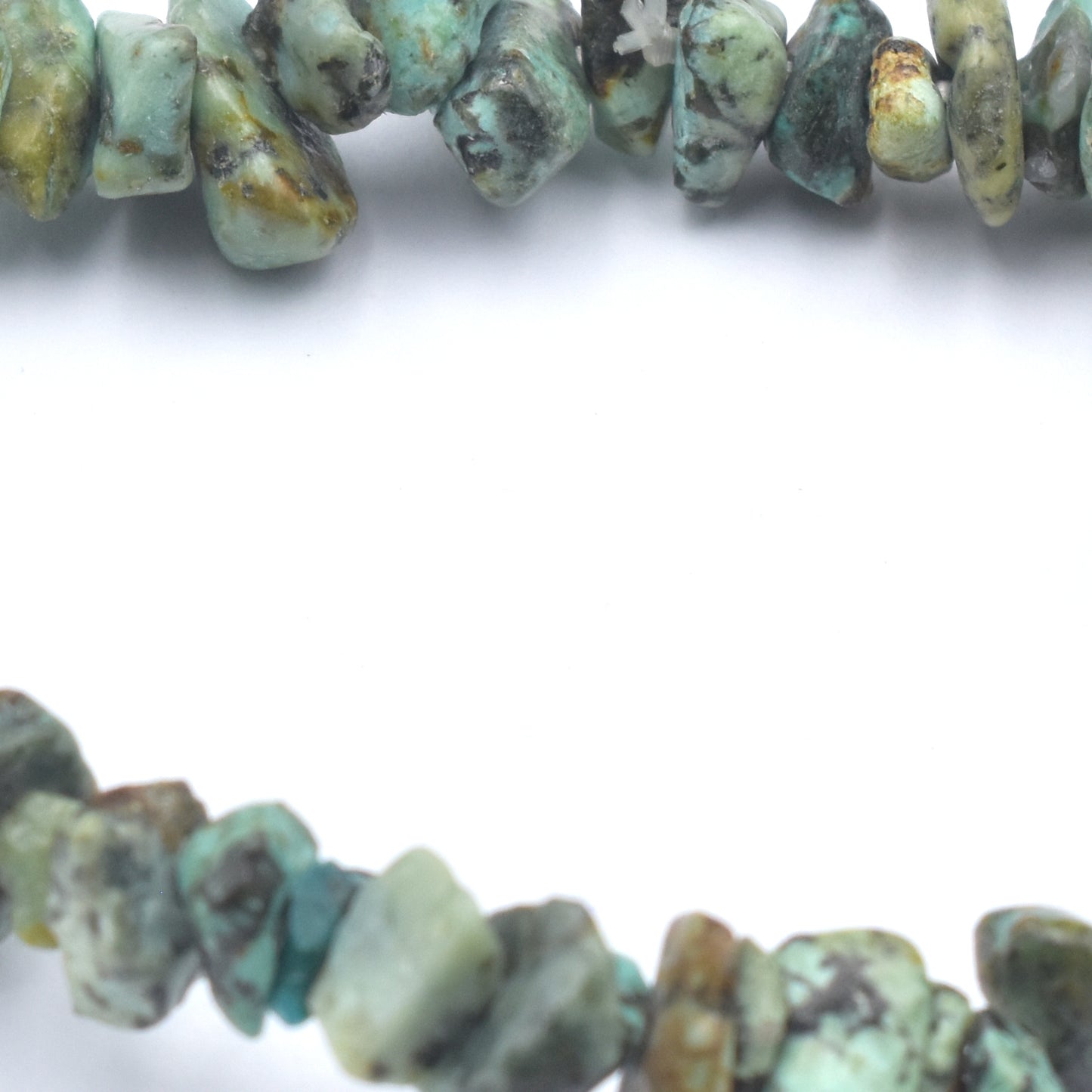 close up of stunning green and black coloured elastic crystal chip bracelet. made using high quality african turquoise chips