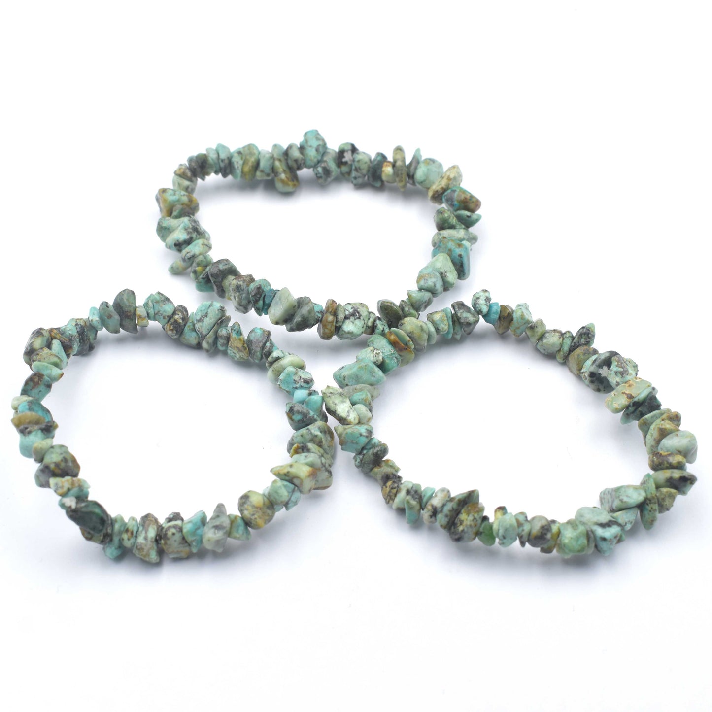 3 bracelets laying in a triangle. stunning green and black coloured elastic crystal chip bracelet. made using high quality african turquoise chips