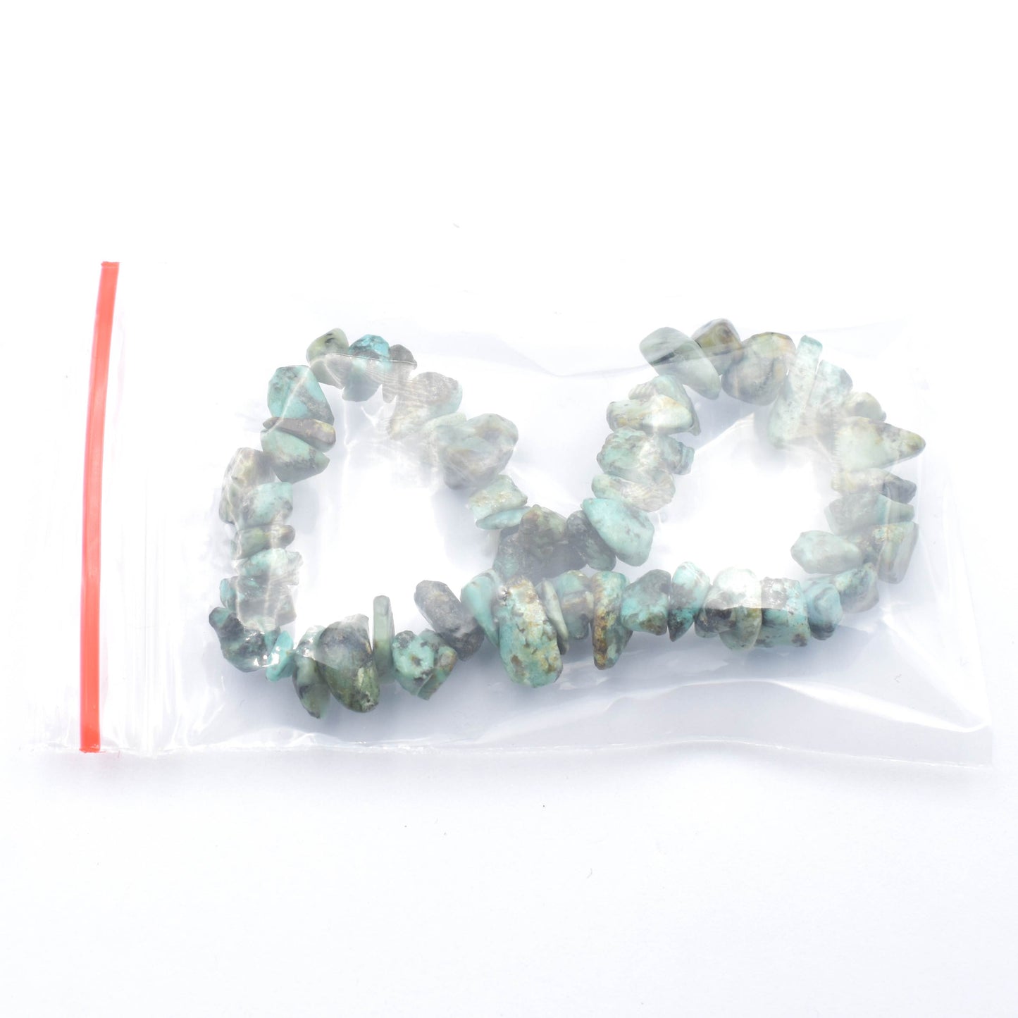 stunning green and black coloured elastic crystal chip bracelet. made using high quality african turquoise chips. bracelet being packed for order.