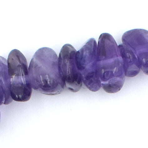 stunning purple coloured elastic crystal chip bracelet. made using high quality amethyst chips. close up.