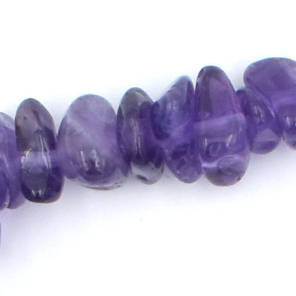 stunning purple coloured elastic crystal chip bracelet. made using high quality amethyst chips. close up.